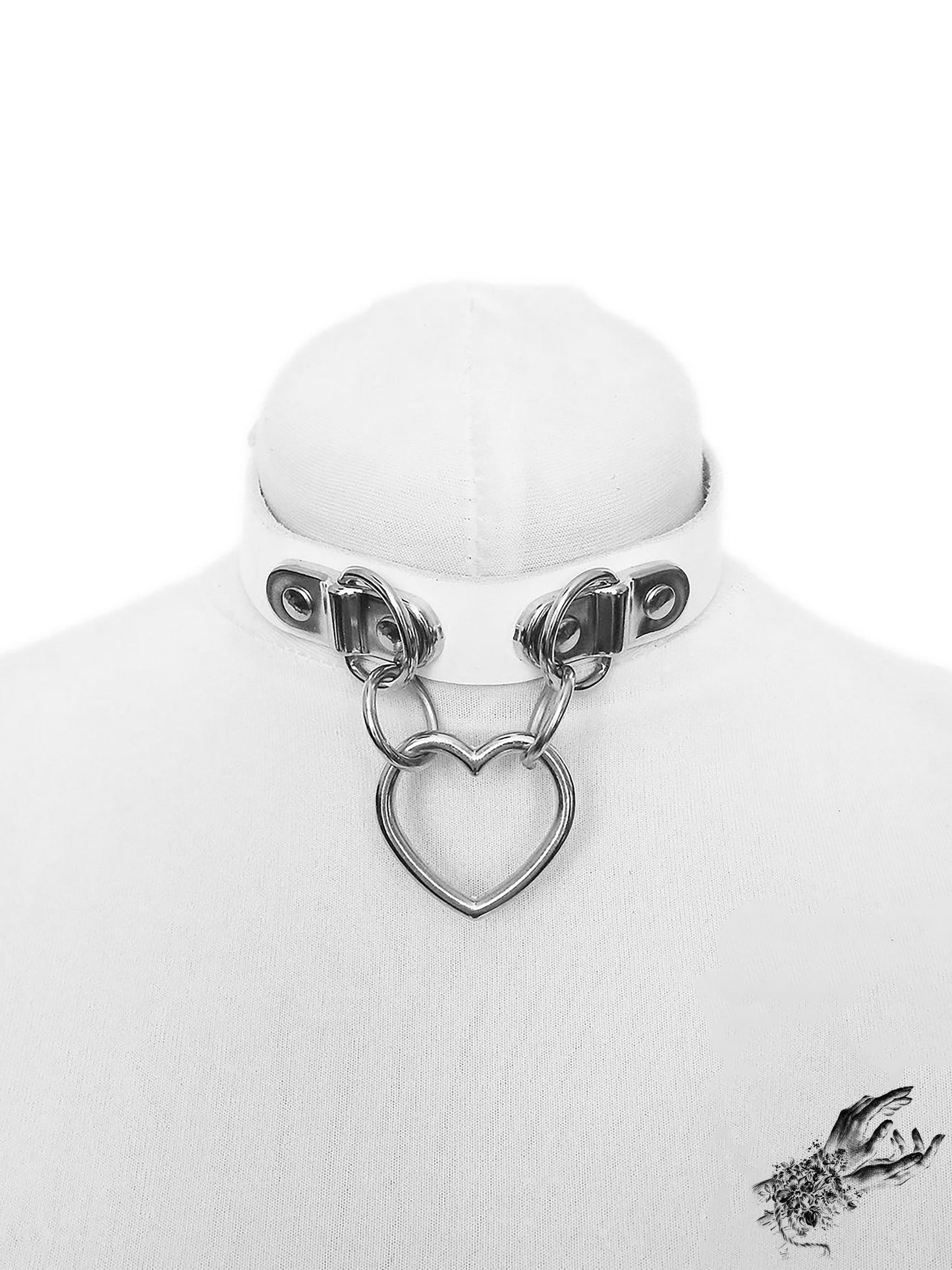 White leather choker with a silver heart-shaped pendant on a white mannequin bust
