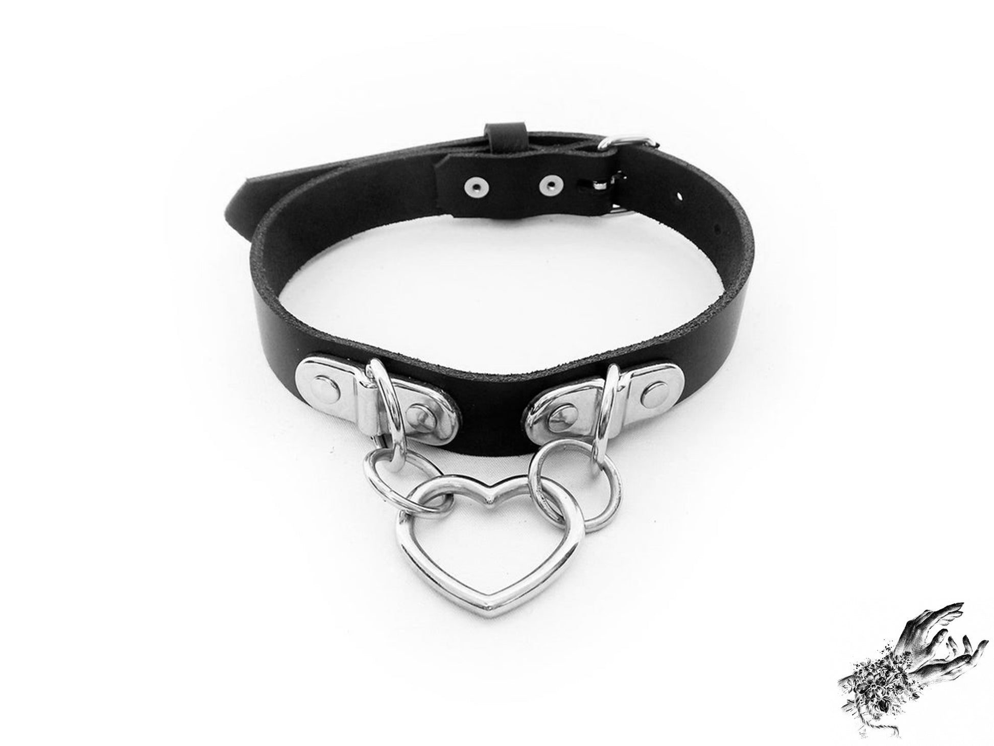 Black leather choker with a silver heart-shaped pendant on a white background