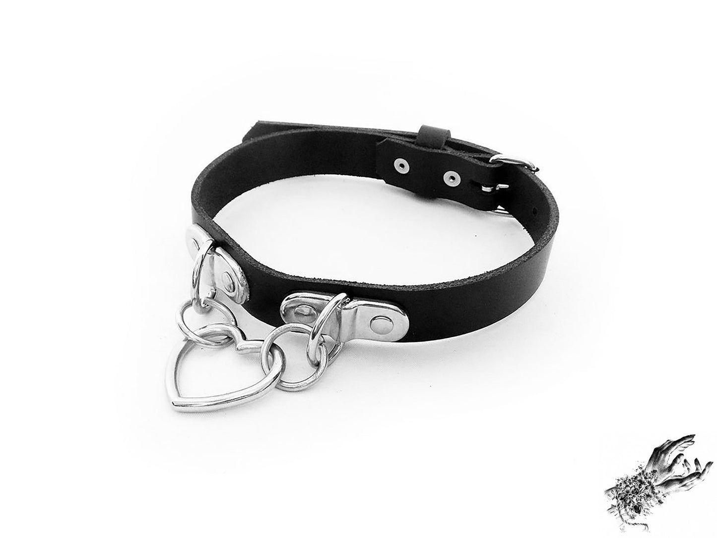Black leather choker with a silver heart-shaped pendant on a white background