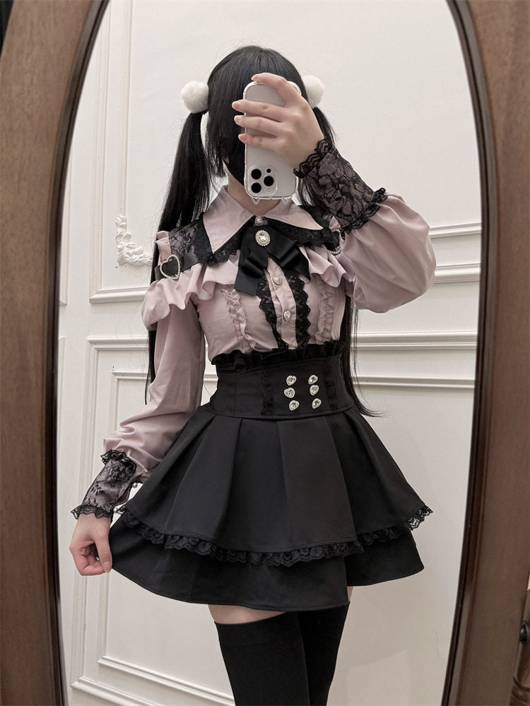 Black high waisted skirt featuring a ruffled waist, diamante heart shaped buttons, pleated a-line design and lace trimmed hem, styled with a pink and black lace blouse for a Jirai Kei aesthetic.