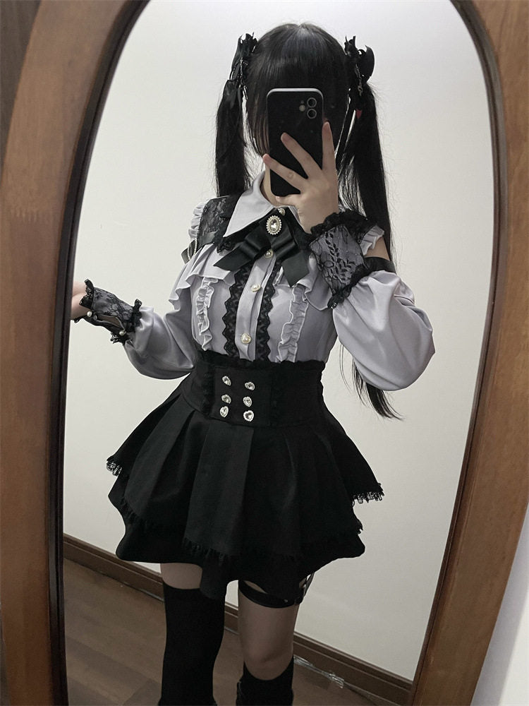 Black high waisted skirt featuring a ruffled waist, diamante heart shaped buttons, pleated a-line design and lace trimmed hem, styled with a grey and black lace blouse for a Jirai Kei aesthetic.