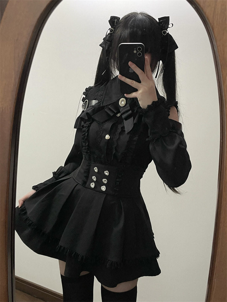 Black high waisted skirt featuring a ruffled waist, diamante heart shaped buttons, pleated a-line design and lace trimmed hem, styled with a black lace blouse for a Jirai Kei aesthetic.