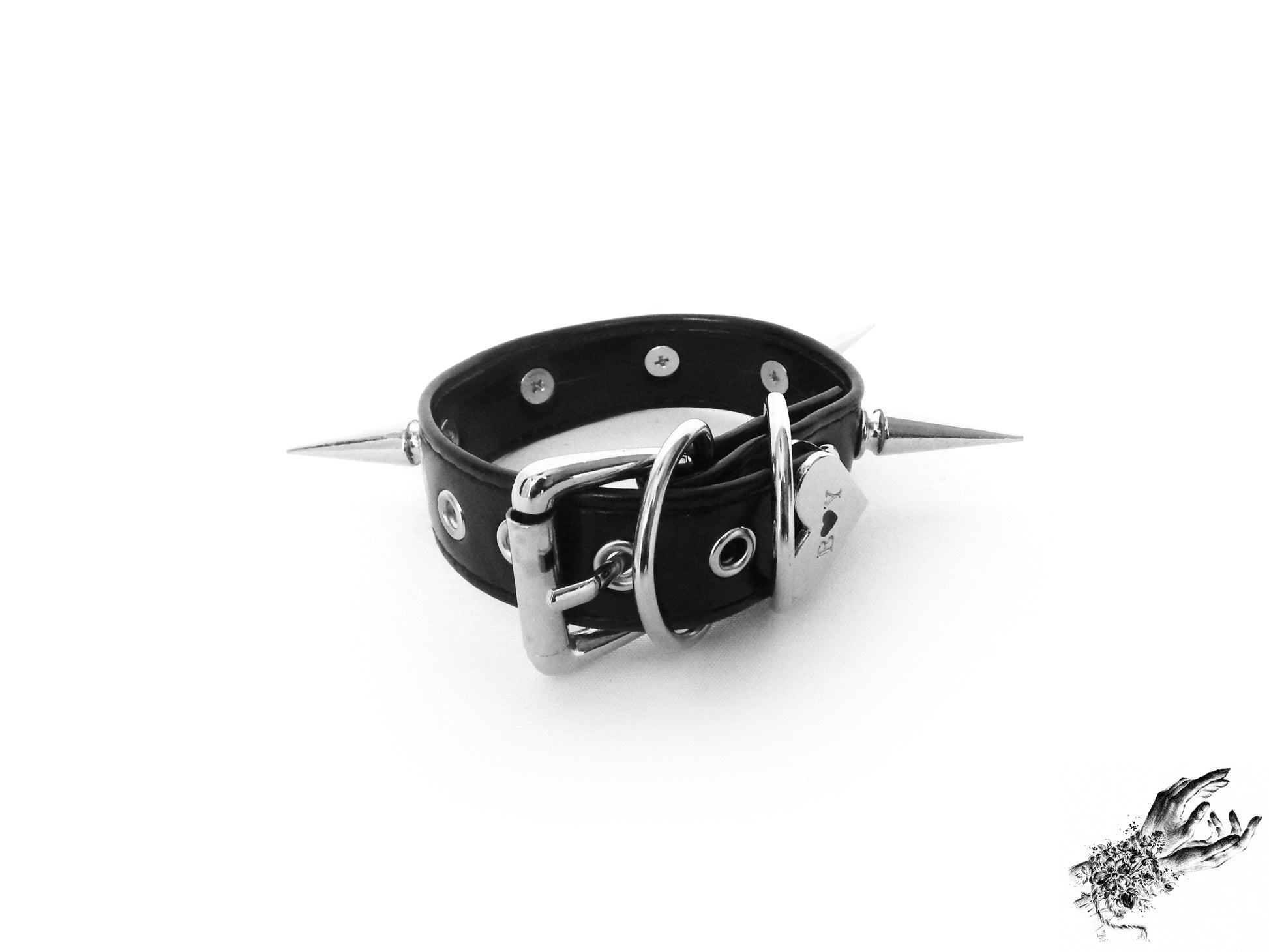 Rear view of the black spike studded wristband, showing the stainless steel plated buckle and adjustable holes