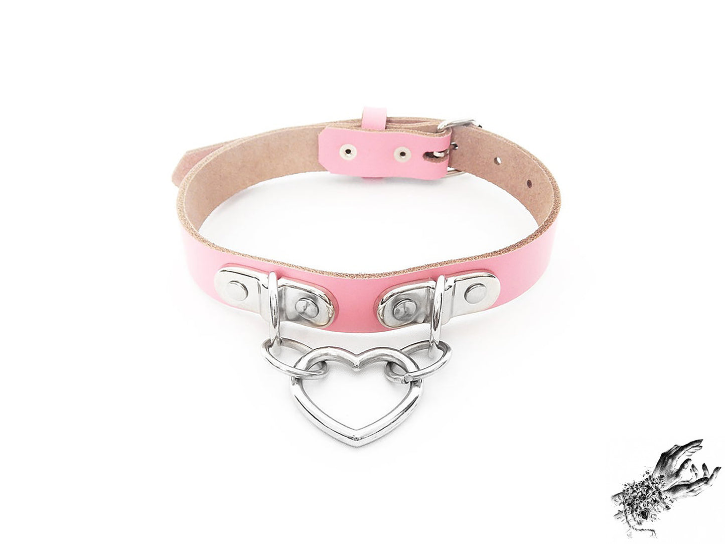 Pink leather collar with a silver heart-shaped pendant on a white background