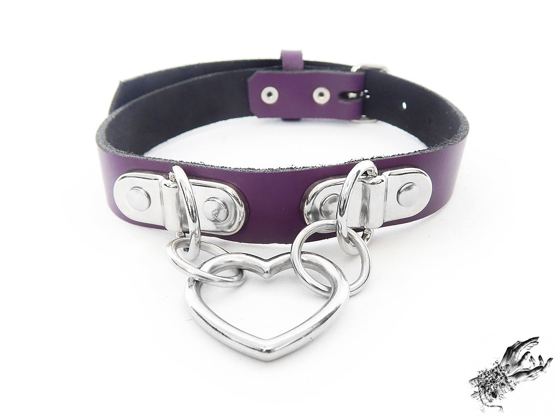 Purple leather collar with a silver heart-shaped pendant on a white background