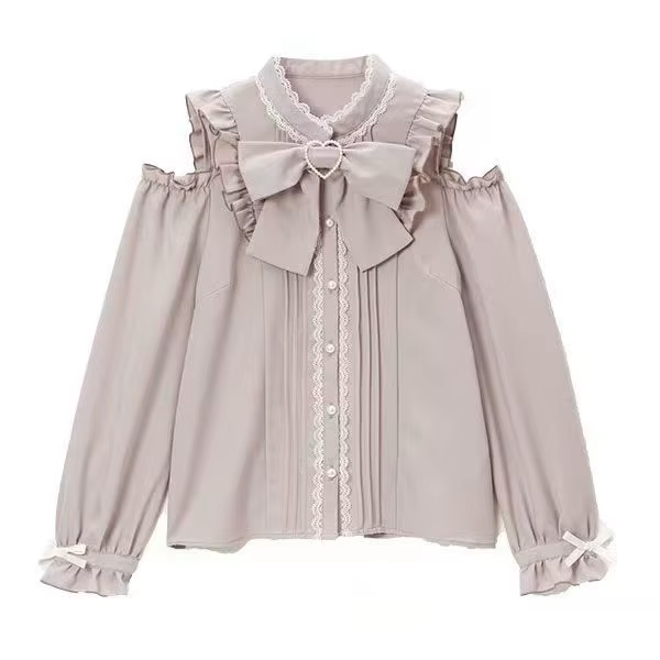 Light lilac polyester blouse featuring cold shoulder cut-outs, lace trimmed collar and button placket, pintucks, white pearlescent buttons and detachable ribbon bow tie, displayed on a mannequin against a white background.