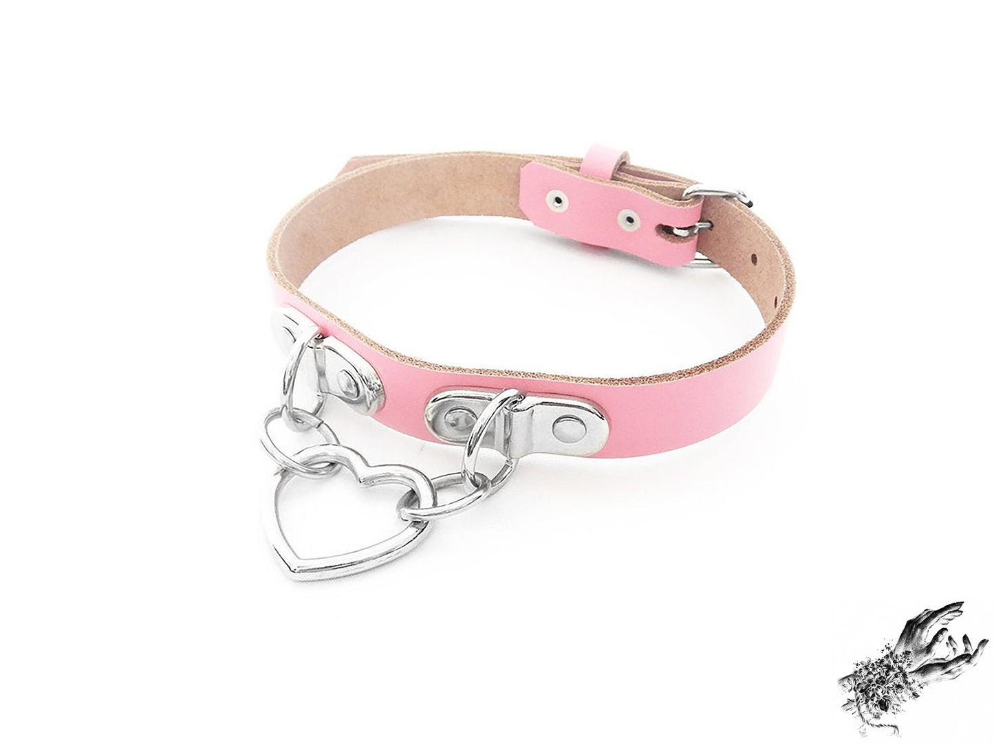 Pink leather collar with a silver heart-shaped pendant on a white background