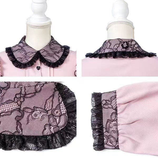 Close-up of a pink and black long sleeved blouse, showing the black lace trimmed Peter Pan collar and cuffs. Displayed on a mannequin against a white background.