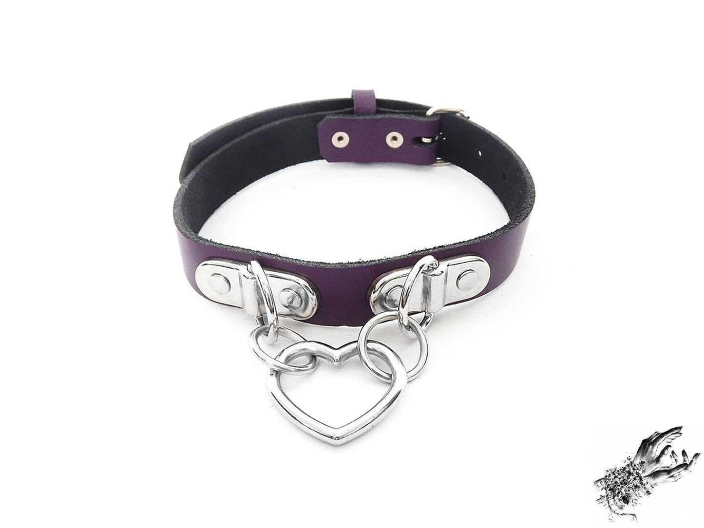 Purple leather collar with a silver heart-shaped pendant on a white background