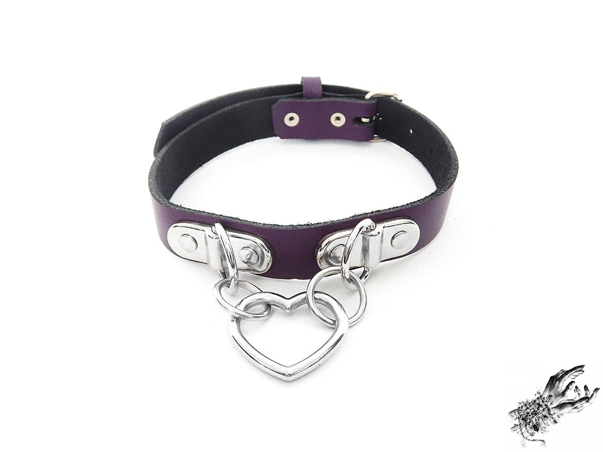 Purple leather collar with a silver heart-shaped pendant on a white background