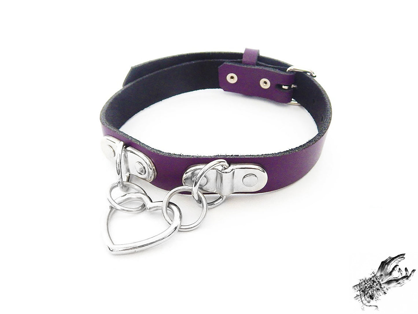 Purple leather collar with a silver heart-shaped pendant on a white background