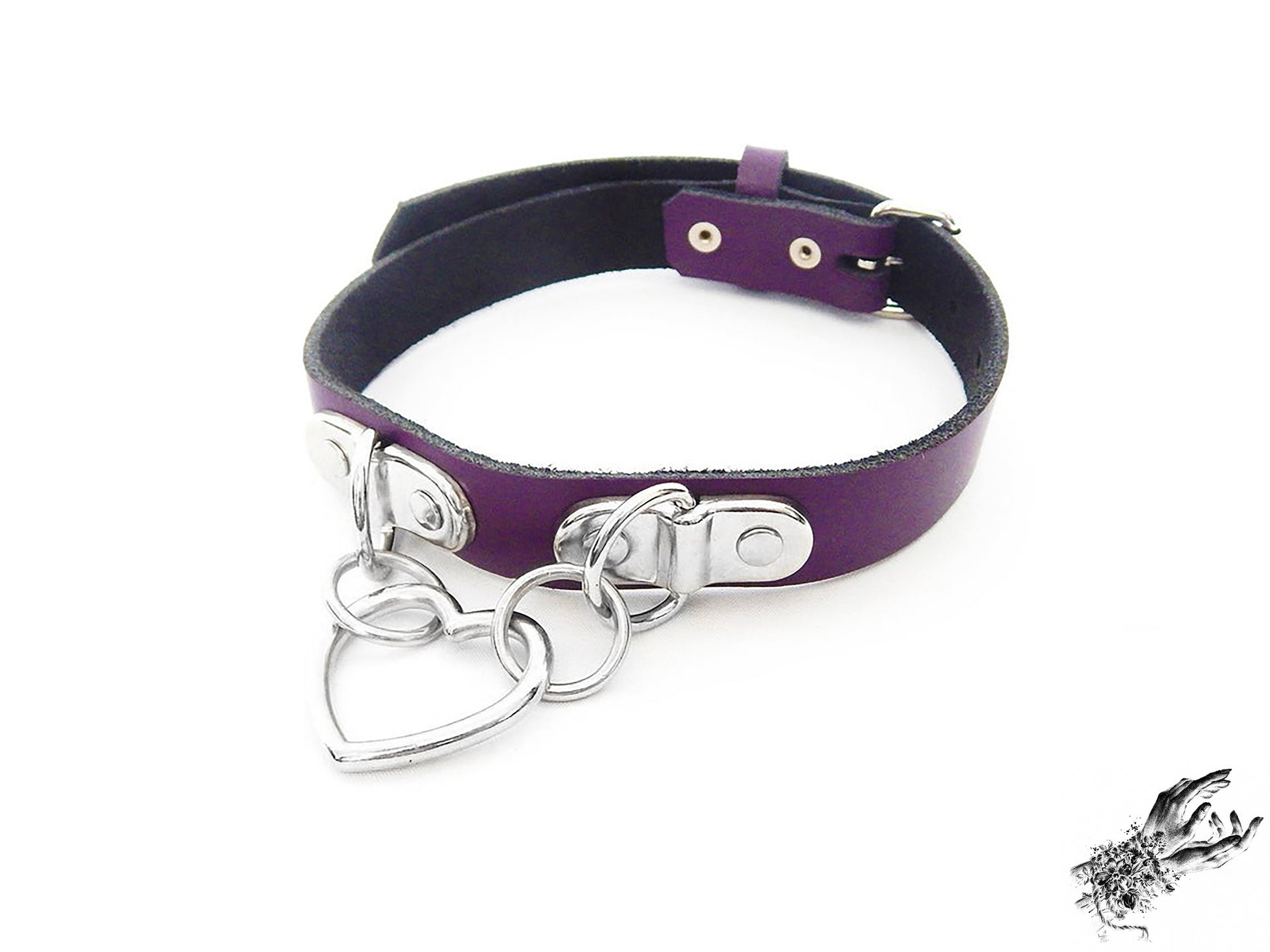 Purple leather collar with a silver heart-shaped pendant on a white background