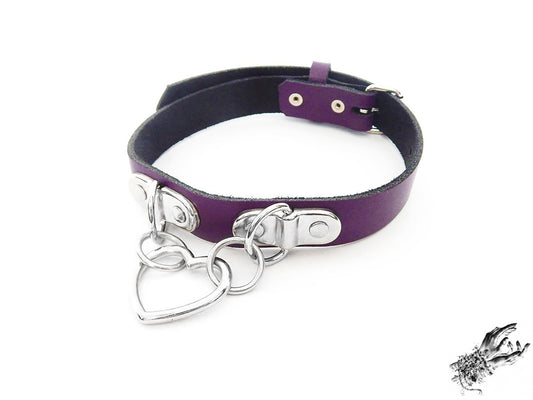 Purple leather collar with a silver heart-shaped pendant on a white background