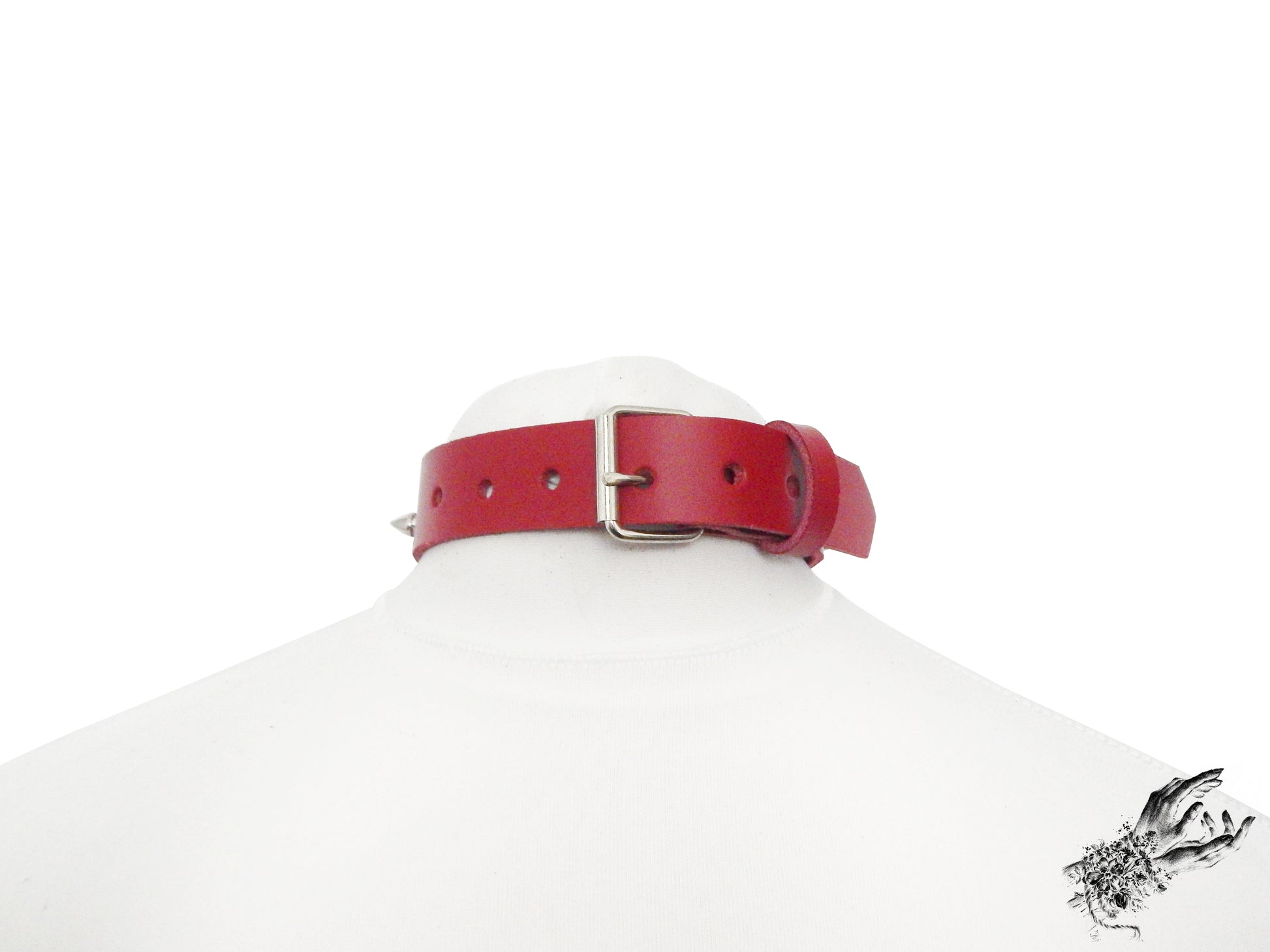 Rear view of a red leather choker showing the silver buckle and adjustable holes on a white mannequin bust