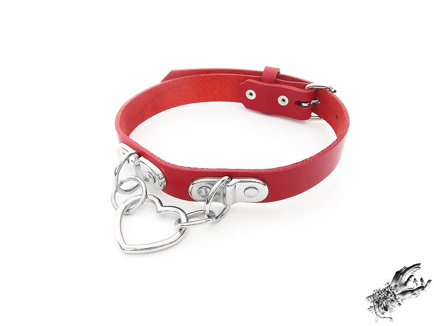 Red leather choker with a silver heart-shaped pendant on a white background