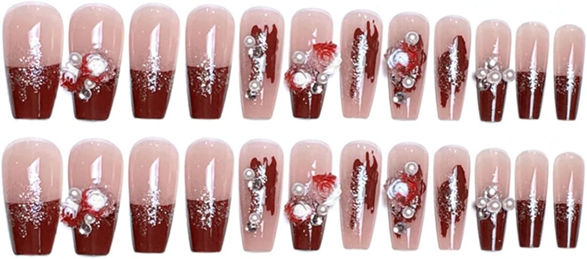 A set of 24 ballerina-shaped false nails arranged in two rows of 12. The nails feature a glossy dark red ombre design starting from a sheer nude-pink base, decorated with silver glitter, white rhinestones, and red rose motifs.