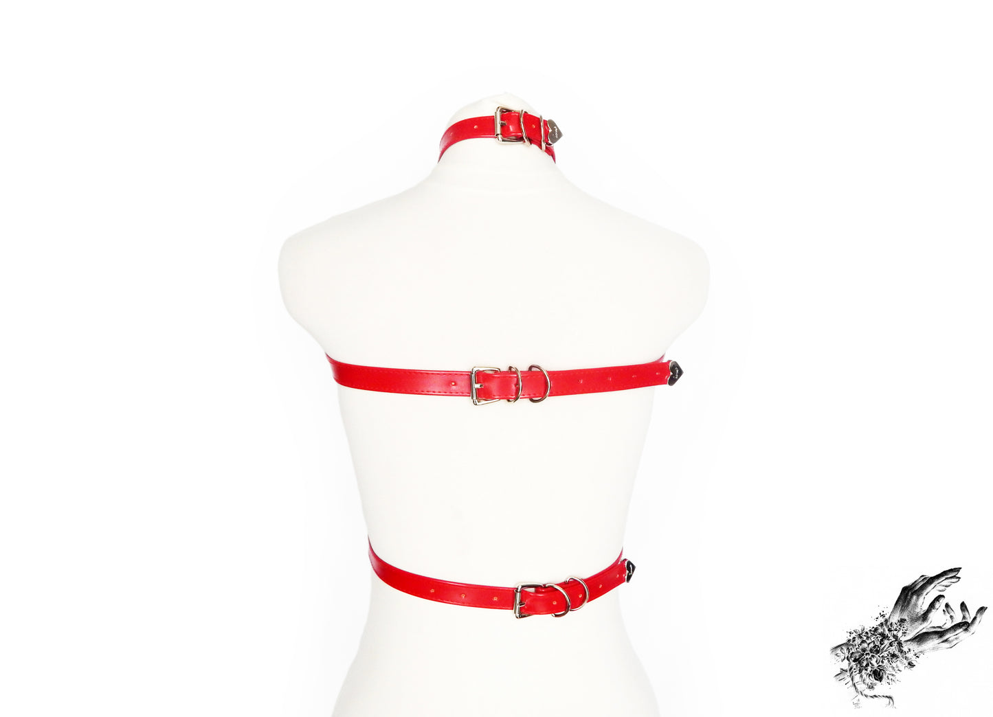 Rear view of a red faux leather chest harness showing the adjustable buckled neck, chest and waist straps, displayed on a mannequin against a white background.