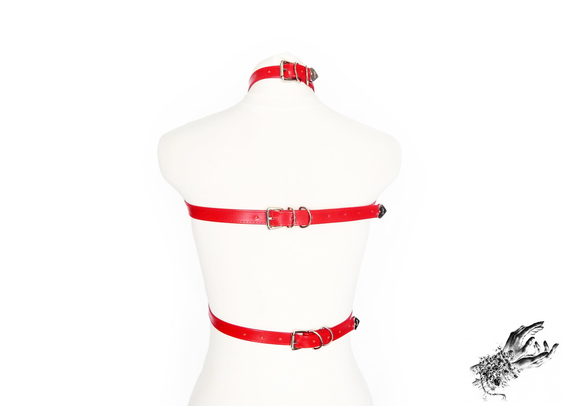 Rear view of a red faux leather chest harness showing the adjustable buckled neck, chest and waist straps, displayed on a mannequin against a white background.