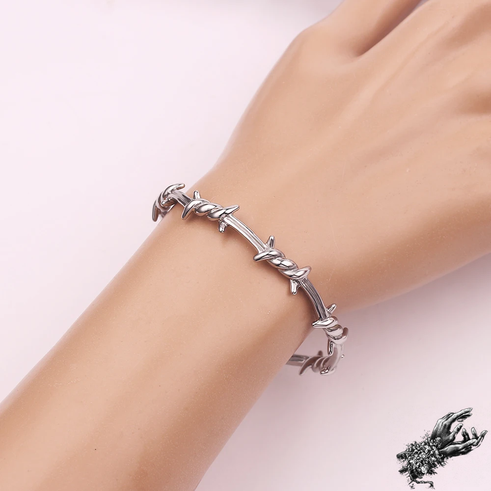Mannequin photo of stainless steel barbed wire bangle for gothic fashion