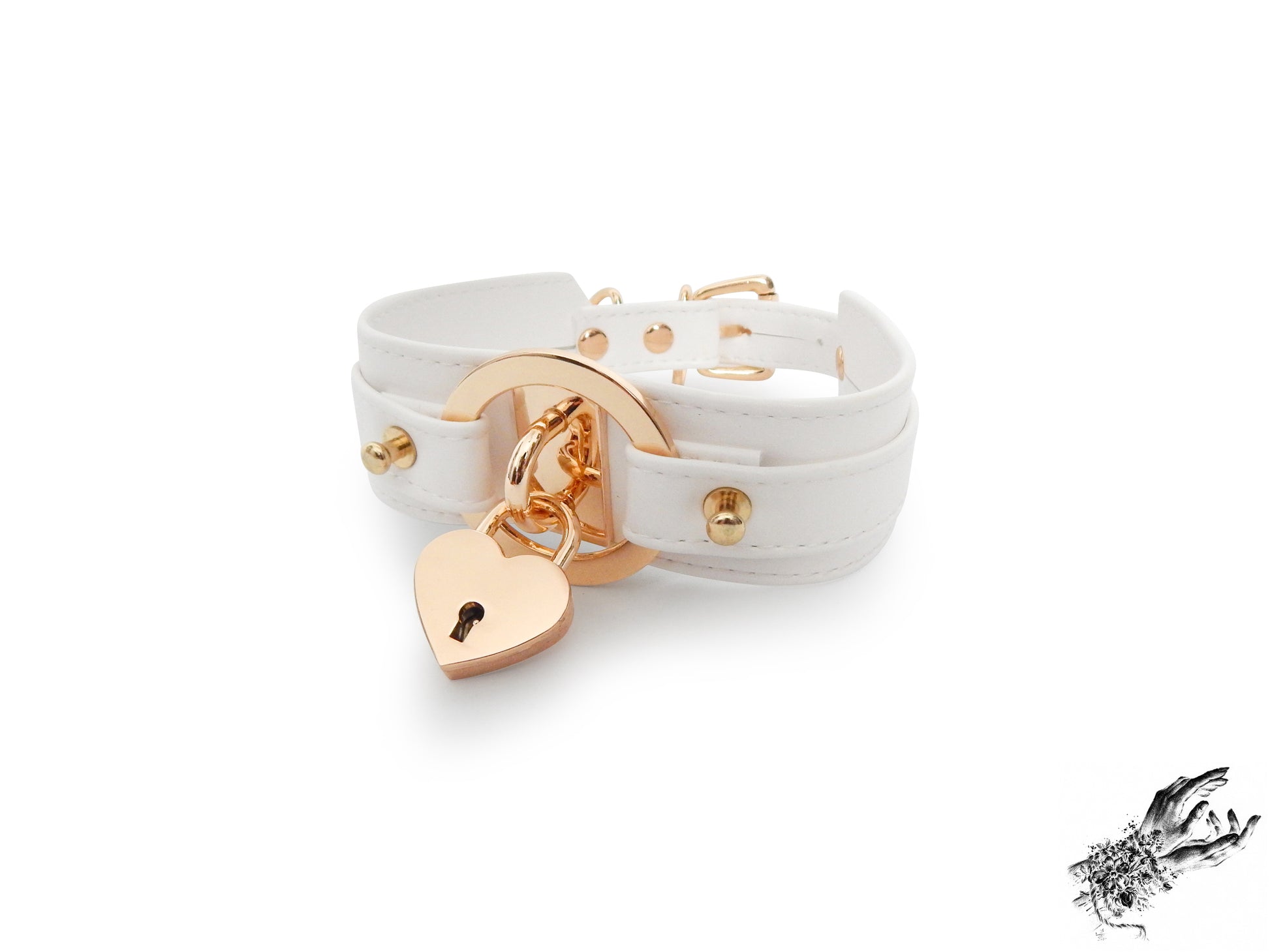 White faux leather choker featuring central gold tone hardware including an O-ring and removable heart padlock. Displayed on a white background.