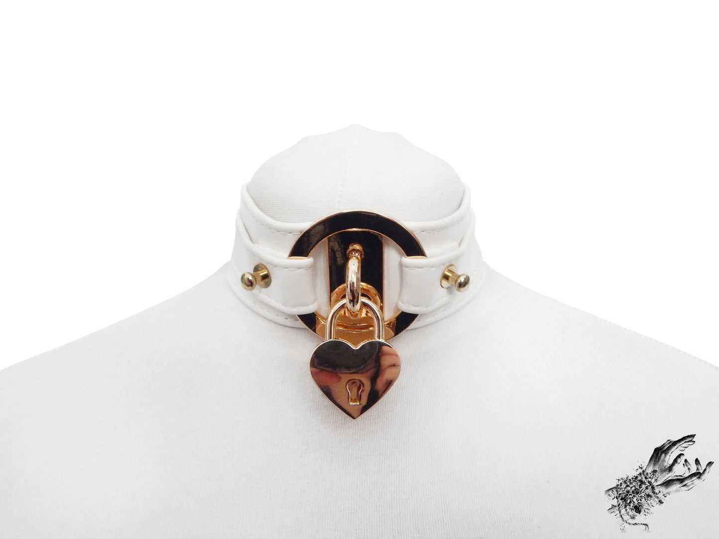 White faux leather choker featuring central gold tone hardware including an O-ring and removable heart padlock. Displayed on a white mannequin bust against a white background.