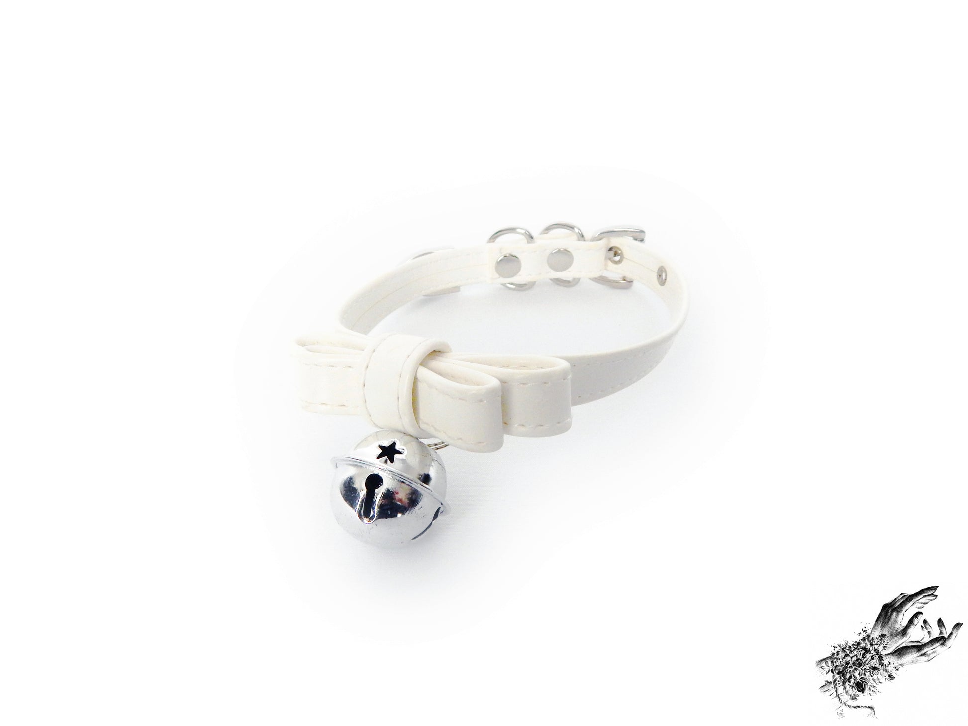 White faux leather bow choker featuring a silver bell design, with adjustable buckle at the back