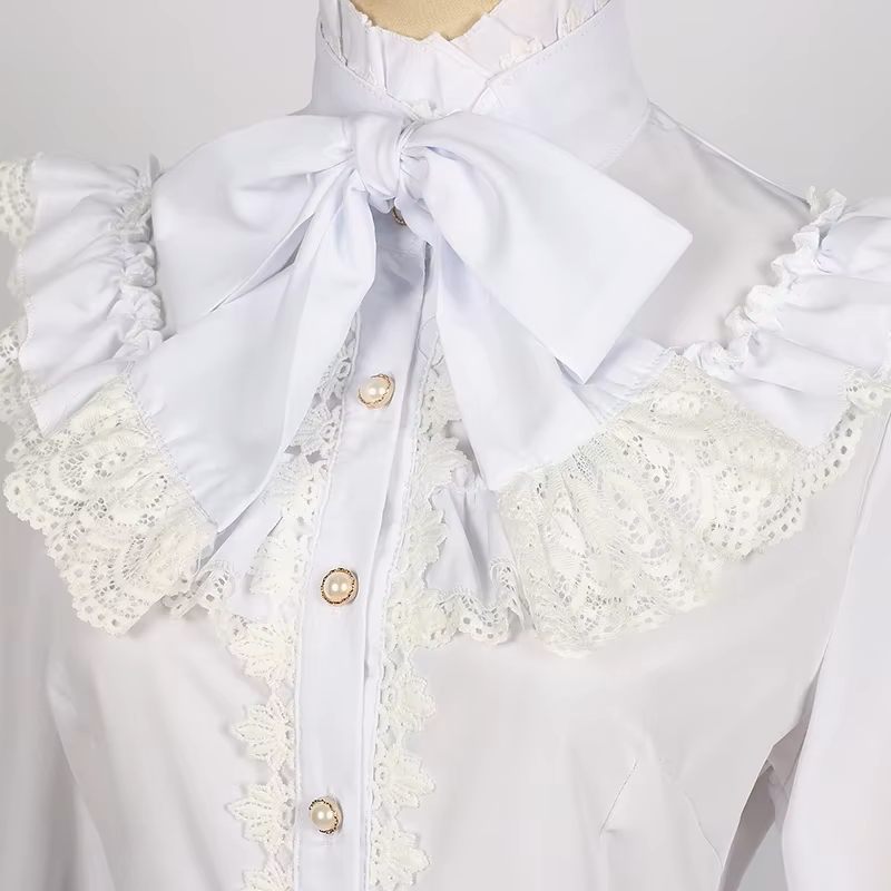 Side view of a white polyester blouse showing the high ruffle neck, bow tie, lace collar and gold and white pearlescent buttons, displayed on a white mannequin against a white background.