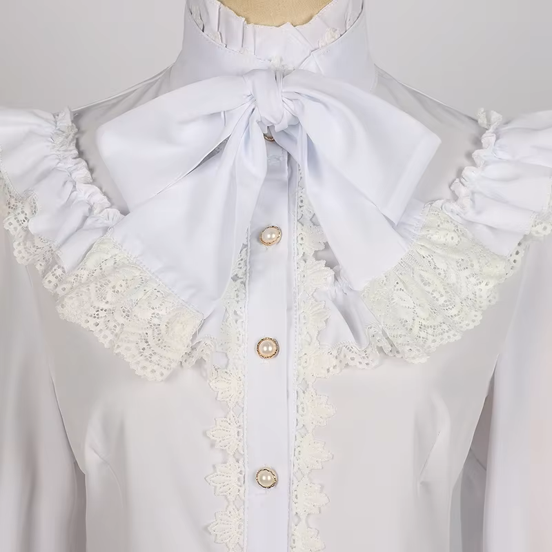 Close-up of a white polyester blouse showing the high ruffle neck, bow tie and lace collar, displayed on a mannequin against a white background.