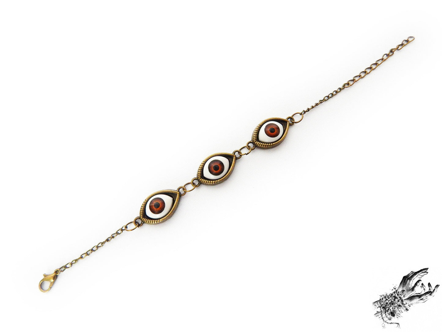 Vintage inspired antique bronze evil eye bracelet showing the rich brown irises in bronze cameo frames