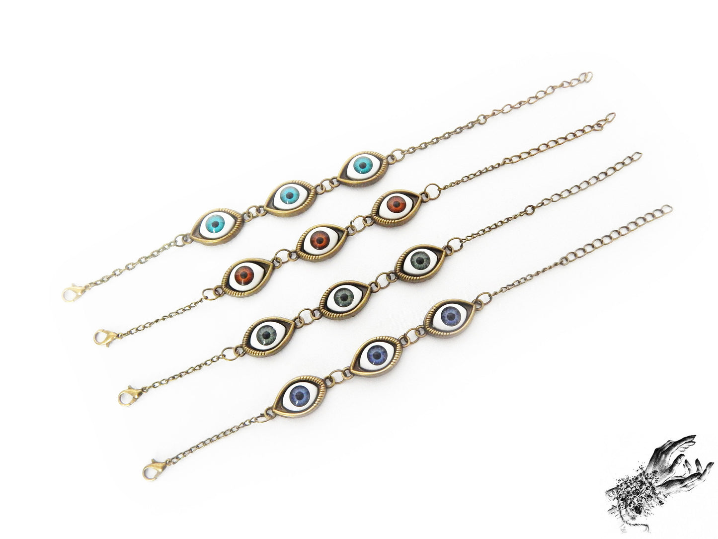 Antique style evil eye cameo bracelets featuring a variety of iris colours in blue, green and brown displayed on a white background