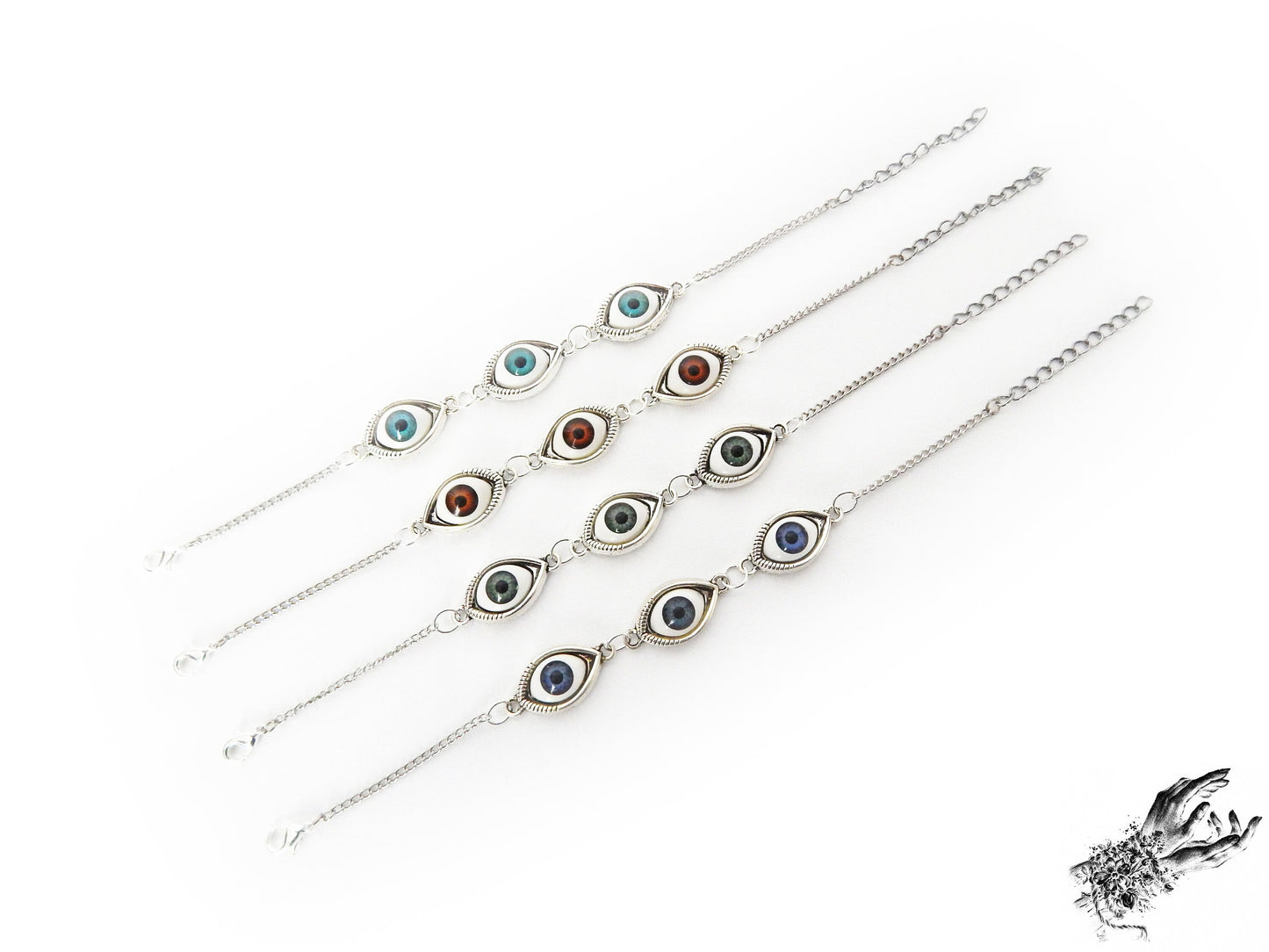 Antique style evil eye cameo bracelets featuring a variety of iris colours in blue, green and brown in silver cameo frames, displayed on a white background