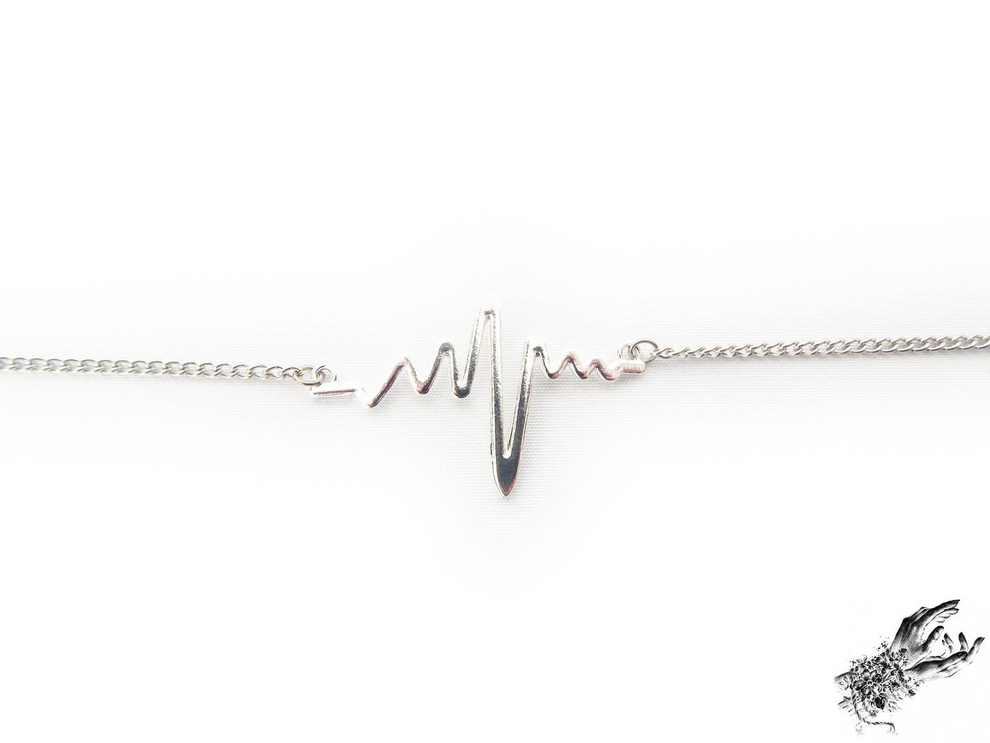 Close-up of the antique silver bracelet, showing the dainty yet striking heartbeat charm, a perfect gift for cardiologist and medical students in the UK
