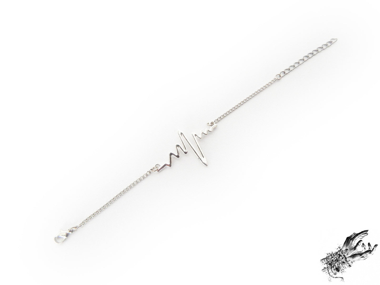 Antique silver bracelet featuring a central silver heartbeat connector charm, creating a medical inspired aesthetic perfect for cardiologist gift or medical students