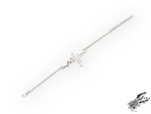 Antique silver bracelet featuring a central silver heartbeat connector charm, creating a medical inspired aesthetic perfect for cardiologist gift or medical students