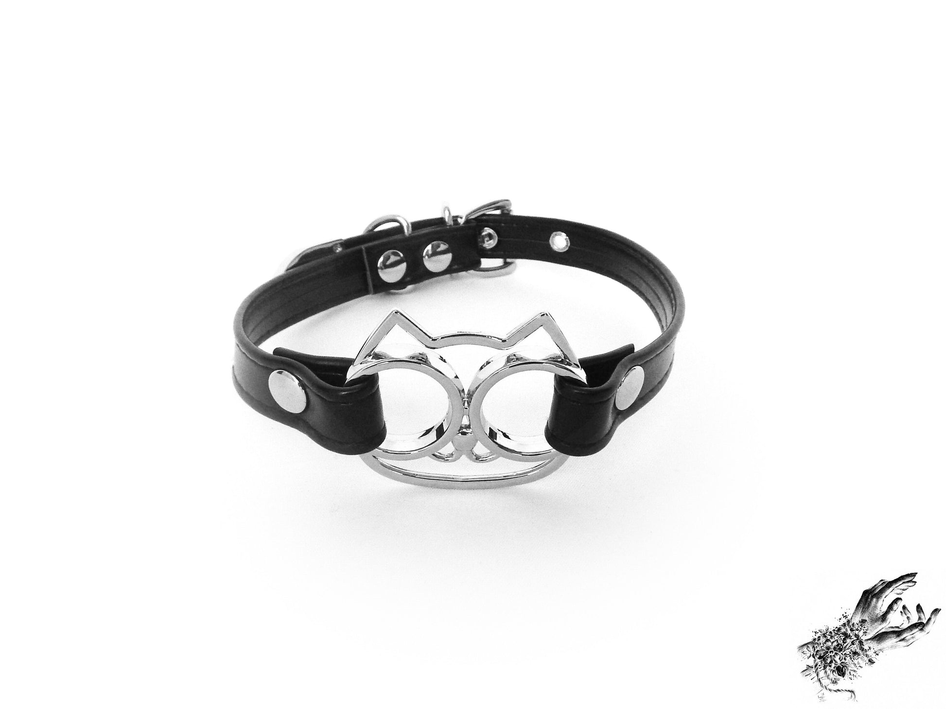 Black faux leather choker showing the central silver cat shaped pendant securely attached with silver rivets