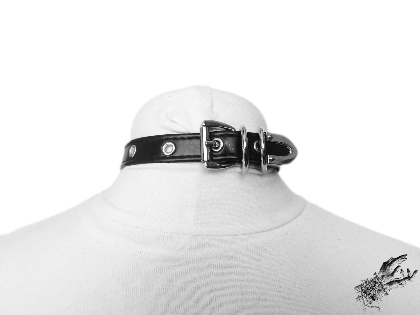 Rear view of the black faux leather cat charm choker, showing the stainless steel plated buckle and adjustable holes for versatile sizing, displayed on a white mannequin bust