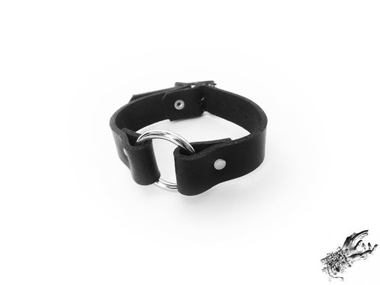Black leather O ring wristband made in the UK with genuine leather and stainless steel plated hardware for gothic and alt fashion
