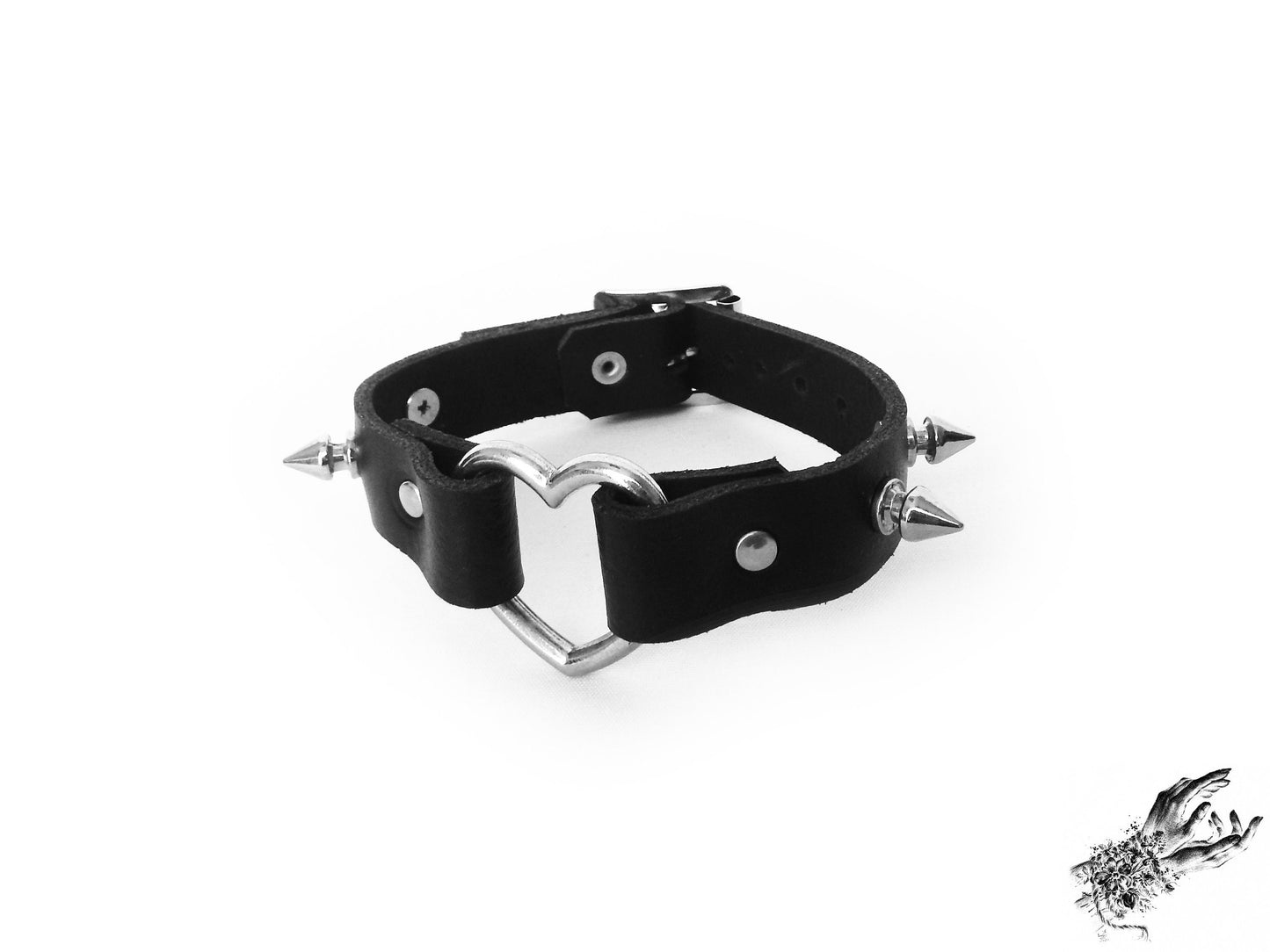 Black studded heart ring wristband, made with genuine leather and stainless steel plated hardware in the UK for gothic and alt fashion