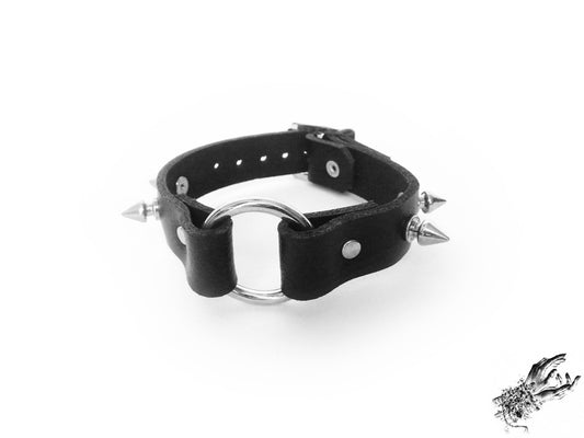 Black studded O ring wristband, made with genuine leather and stainless steel hardware for gothic and alternative fashion in the UK
