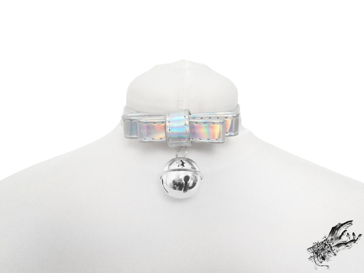 Holographic silver bow choker featuring a silver bell with adjustable buckle at the back, displayed on a white mannequin bust