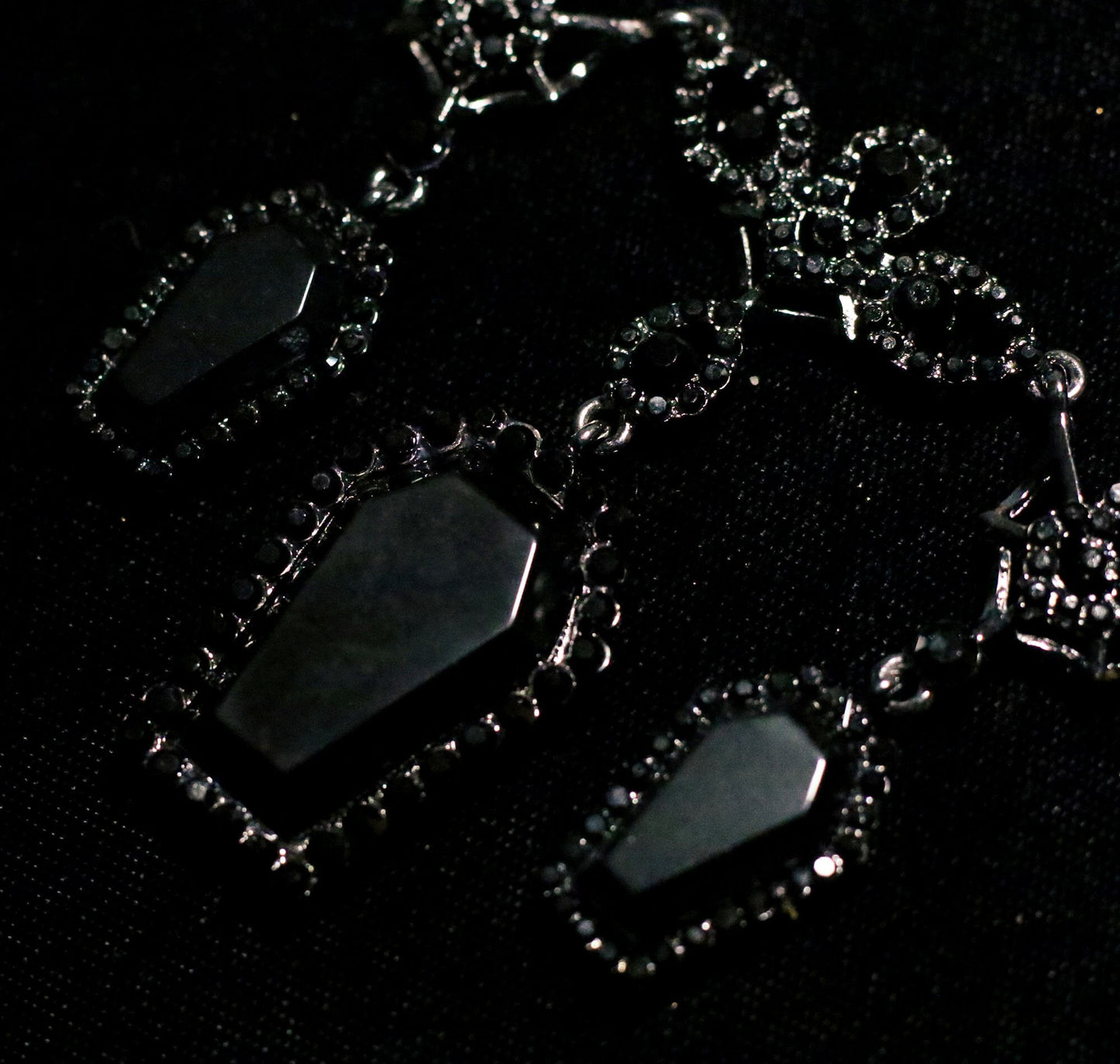 PRE-ORDER - Puvithel Resurrection Earrings, Gunmetal Black Metal Coffin Earrings