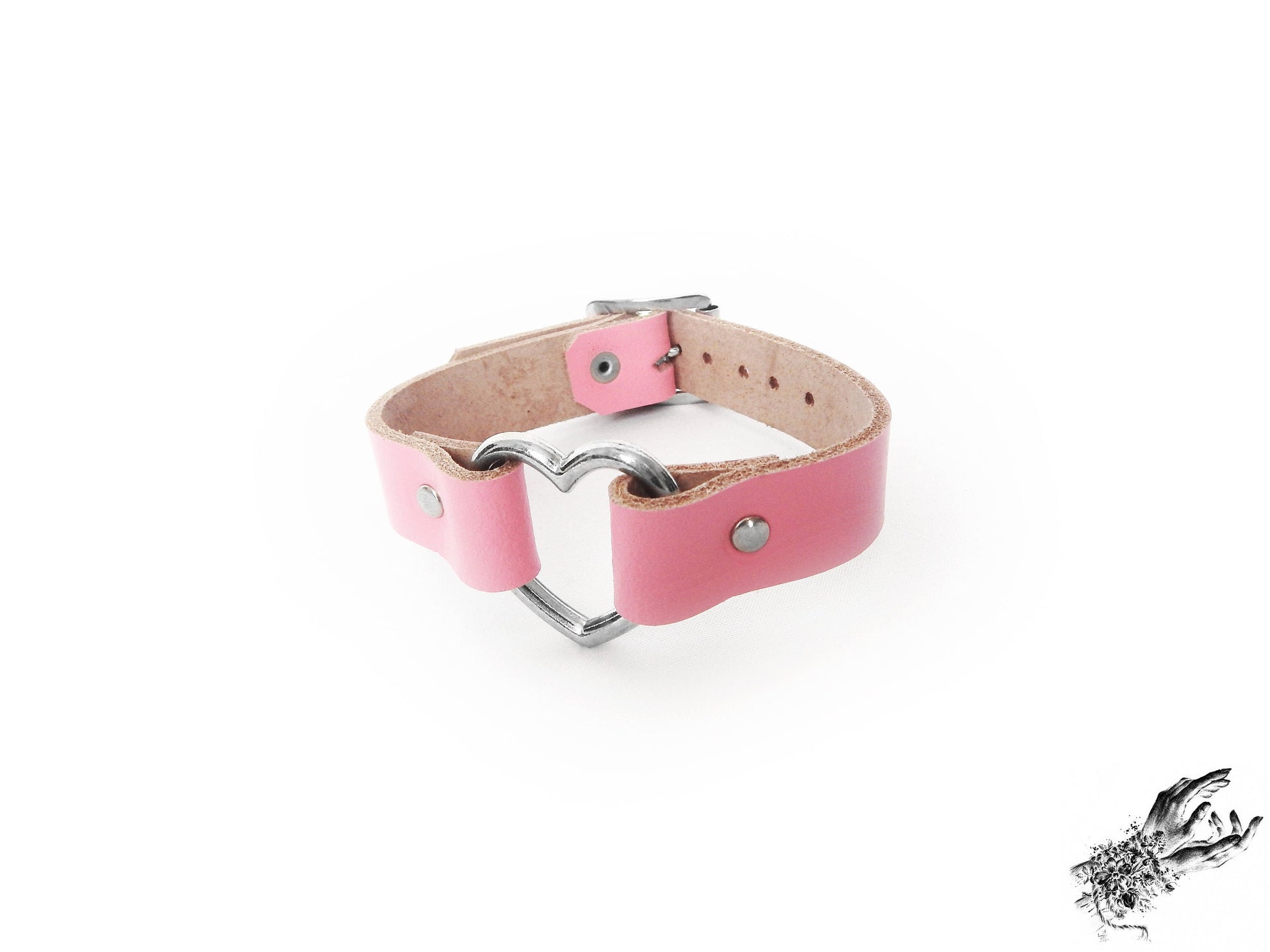 Pink leather heart ring wristband made with genuine leather and stainless steel hardware, for pastel goth and kawaii fashion in the UK