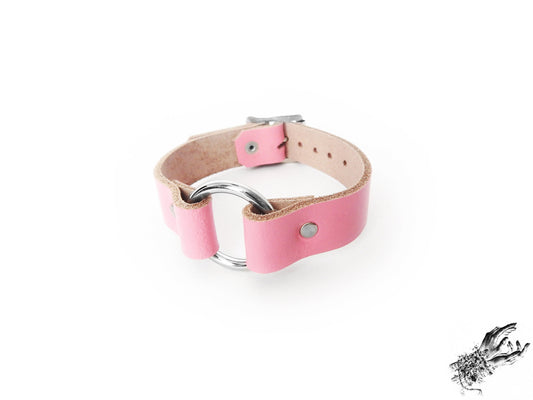 Pink leather O ring wristband made with genuine leather and stainless steel plated hardware in the UK