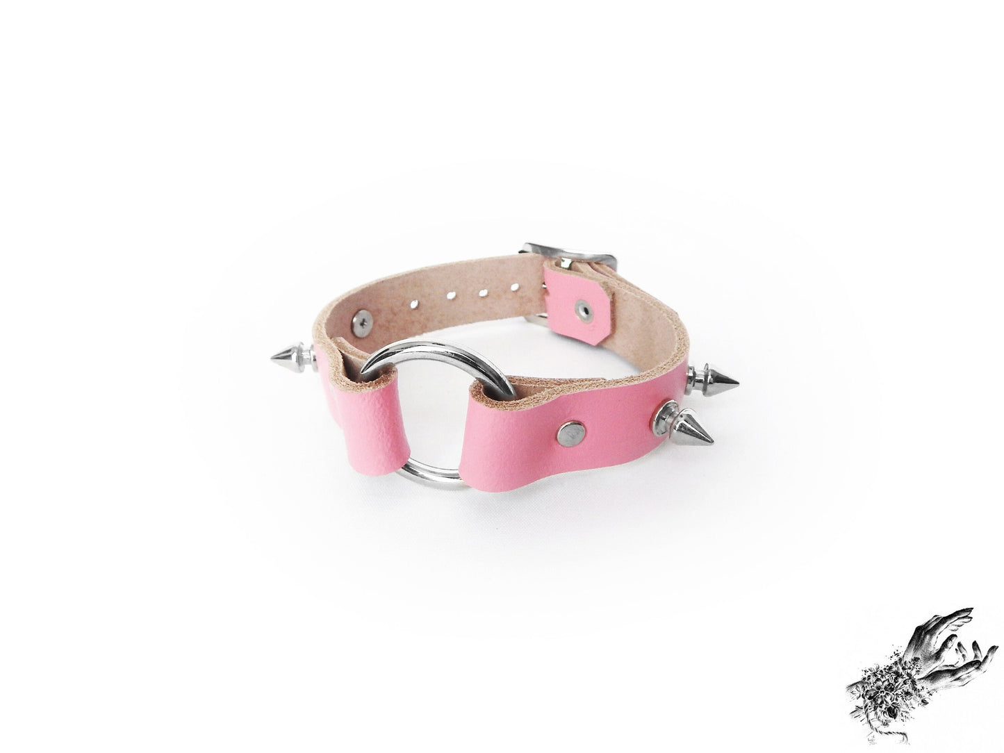 Pink studded O ring wristband made with genuine leather and stainless steel plated hardware, for kawaii and pastel goth fashion