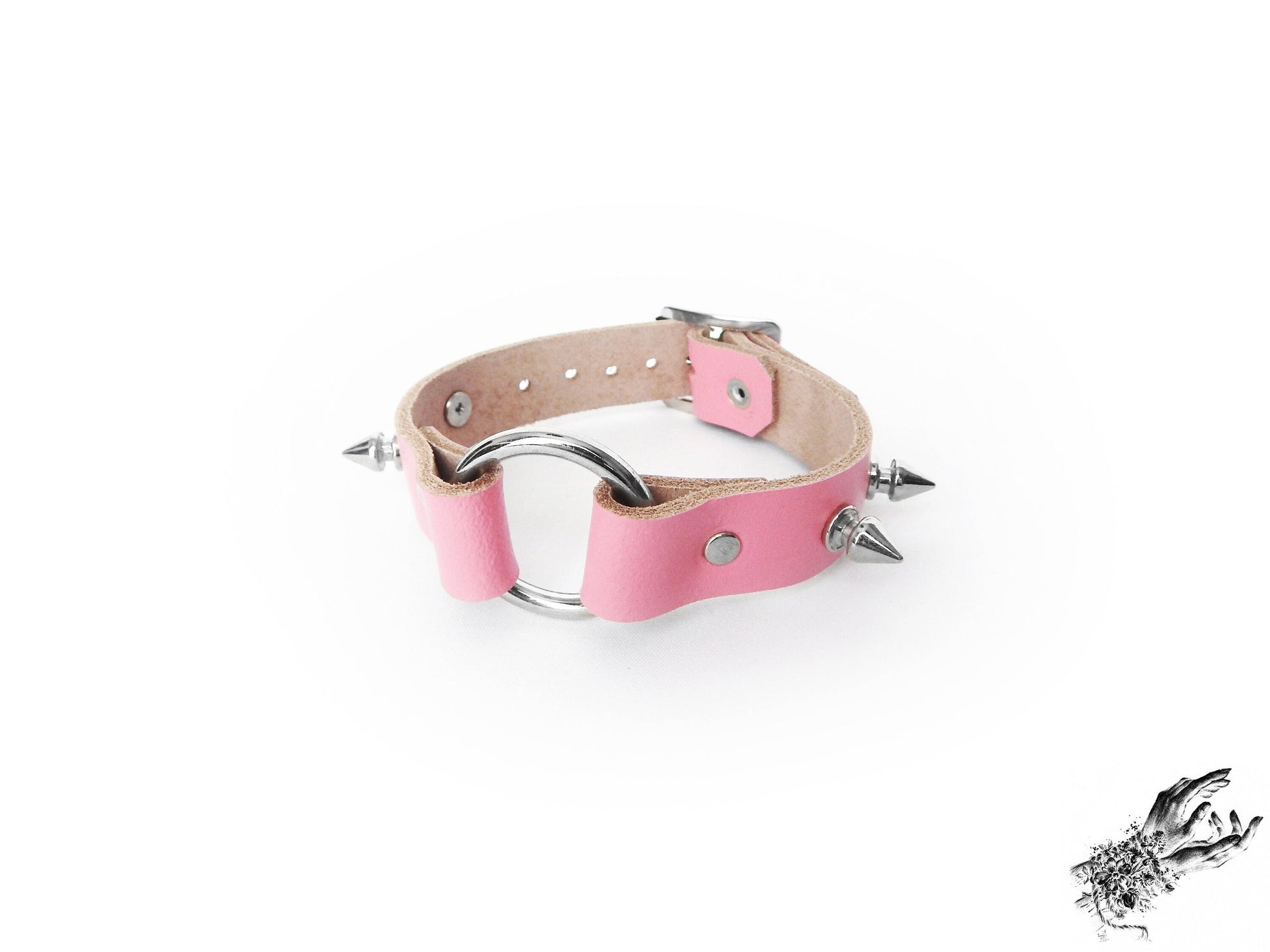 Pink studded O ring wristband made with genuine leather and stainless steel plated hardware, for kawaii and pastel goth fashion