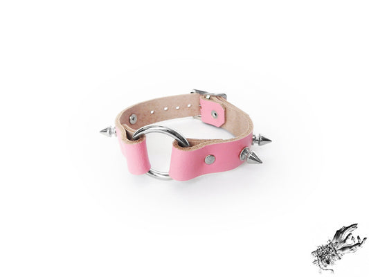 Pink studded O ring wristband made with genuine leather and stainless steel plated hardware, for kawaii and pastel goth fashion