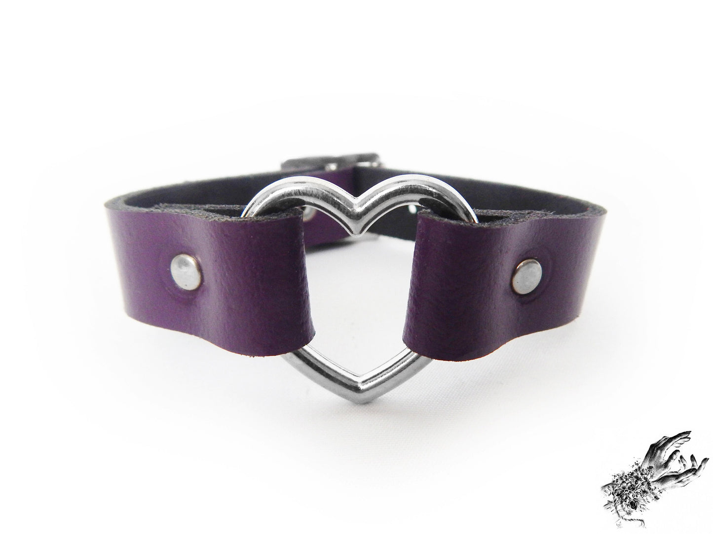 Close-up of the purple leather heart ring wristband, showing the silver heart ring and durable silver rivets