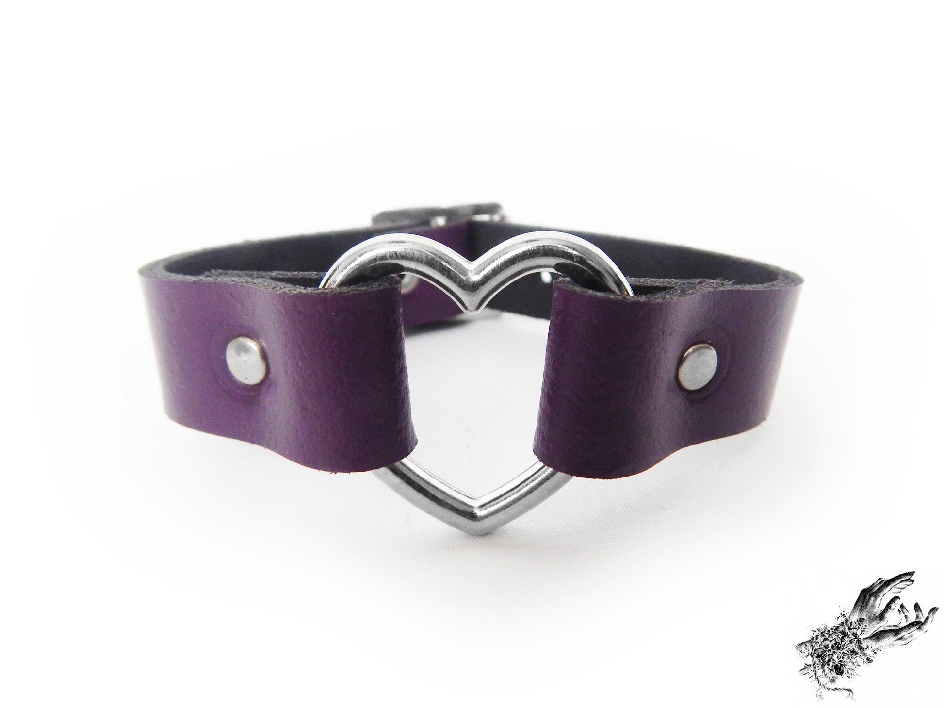 Close-up of the purple leather heart ring wristband, showing the silver heart ring and durable silver rivets