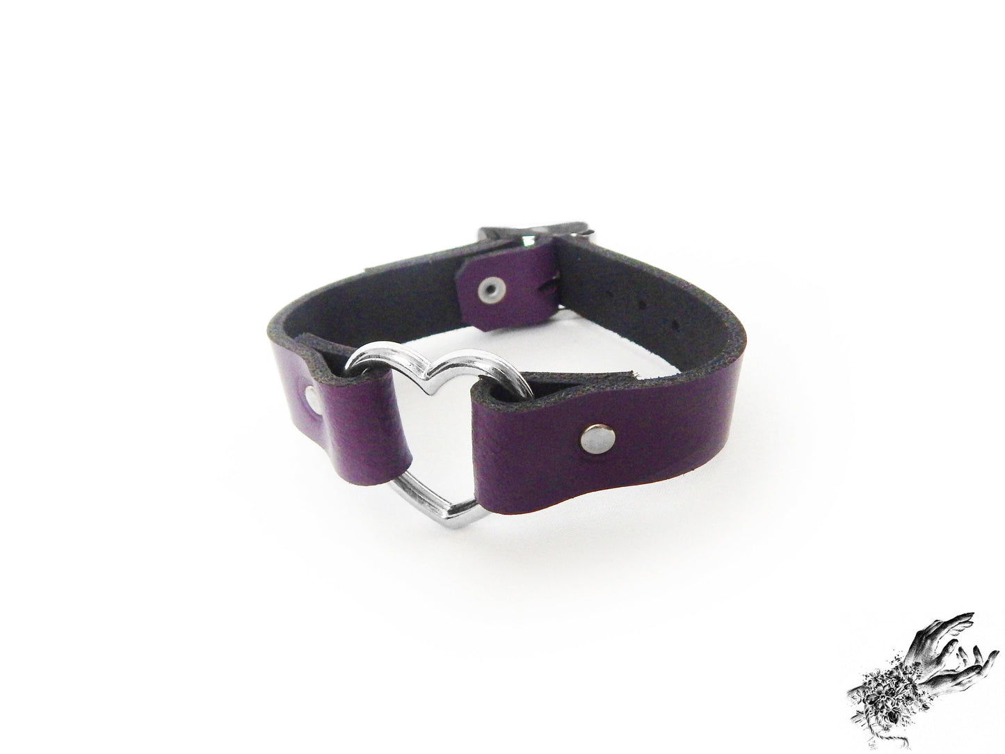 Purple leather wristband featuring a central silver heart ring and adjustable buckle