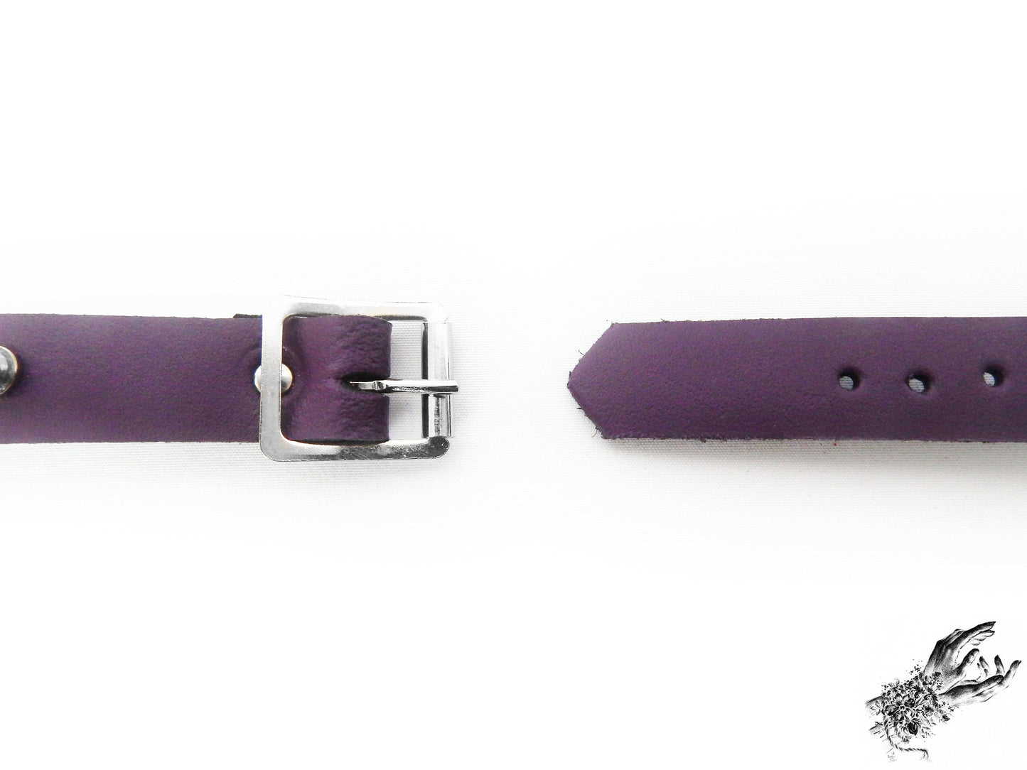 Close-up of the buckle on the purple studded o ring wristband, showing the stainless steel plated buckle and adjustable holes for versatile sizing